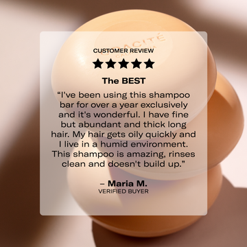 A review on a clear box overlaps Odacité Luxe Experience bars, with the products and packaging visible underneath.