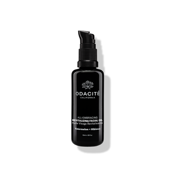 Black Odacite All-Embracing Watermelon + Hibiscus Revitalizing Facial Oil bottle on a plain light background.
