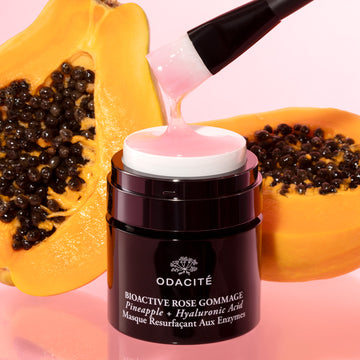 Odacite Bioactive Rose Gommage Mask with pineapple and hyaluronic acid in a jar, labeled with ingredients on the front.