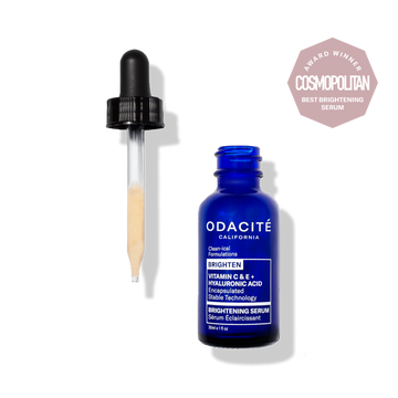 Odacité Brightening Serum with Vitamin C & E and Hyaluronic Acid in a dropper bottle, next to Cosmopolitan Award badge.