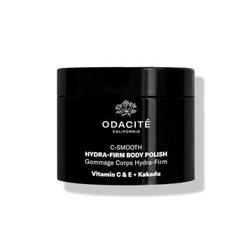 Odacité C-Smooth • Hydra-Firm Body Polish with Vitamin C & E + Kakadu in a black jar against a white background.