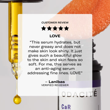 A pipette dispenses serum beside grapefruit, with a 5-star review praising Odacité Vitamin C Glow Set shown in the background.