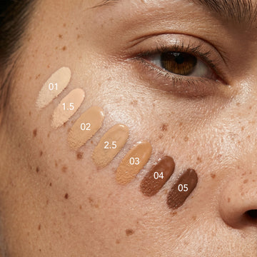 Eight Odacité SPF 50 Tinted Mineral Drops swatches in shades 01-05, shown in a close-up to display color differences.