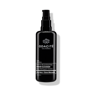 Black bottle of Odacite Gentle Rejuvenating Cream Cleanser with Aloe Vera + Coco Glucoside on a plain white background.