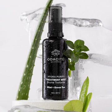 Odacite Hydra-Purify Mint + Green Tea Treatment Mist in a spray bottle, labeled for oily or breakout-prone skin.