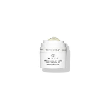 Odacité Intense Repair Eye Cream • Edelweiss Extrême® jar with lid off, showing pale cream inside against a white background.