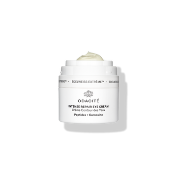 White jar of Odacité Edelweiss Extrême Skin Barrier Set with cream visible inside the open container.