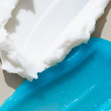Odacité's Smooth & Soothe Duo shows a white cream and a blue gel in separate containers side by side.
