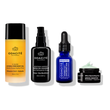 Odacité's Travel Fundamentals—body oil, cleanser, serum, and green moisturizer—in travel bottles on a white background.