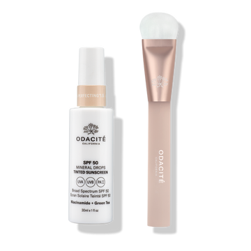 Odacité SPF Tinted Mineral Drops & Brush Duo with sunscreen drops and a soft brush featuring a metallic pink handle.
