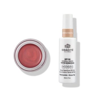 Odacité’s SPF 50 Tinted Sunscreen and Color Balm Duo on a white background, showing product tubes and compact packaging.