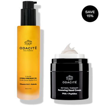 Odacité Vitamin C & Retinol Targeted Body Essentials set with a body oil in a pump bottle and hand cream in a black jar.