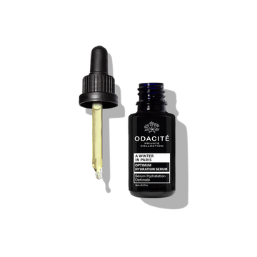 Odacite Optimum Hydration • A Winter in Paris serum bottle with camellia seed oil and dropper on a white background.