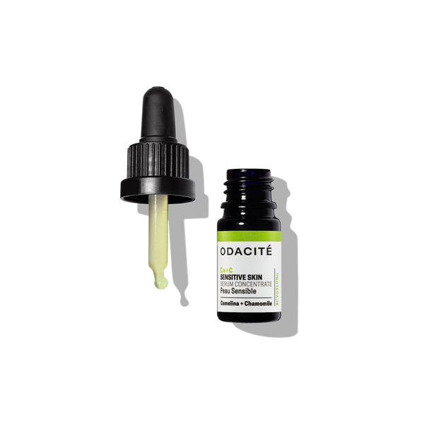 Odacite Ca+C Serum Concentrate in clear bottle with dropper, labeled Camelina + Chamomile for sensitive skin.