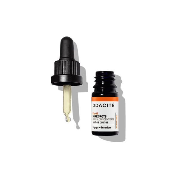 Odacite Dark Spots Papaya + Geranium Pa+G Serum Concentrate bottle with dropper off, set on a white background.