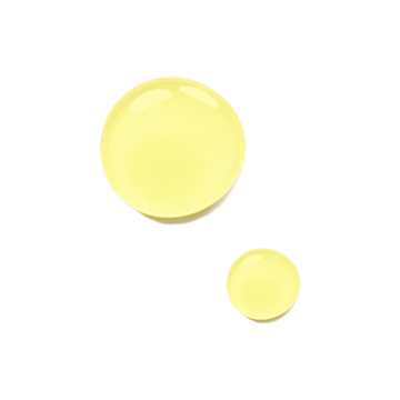 Two glossy yellow drops, one large and one small, of Odacite Ba+S Eye Contour Serum on a white background.