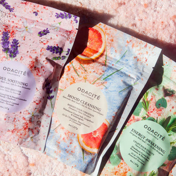 Odacite Energy Awakening Himalayan bath soaks with rosemary and eucalyptus in colorful botanical packaging.