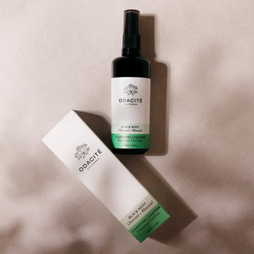 Odacité Double Cleansing Set with Omega Oil Cleanser and Clarifying Cleanser in clear pump bottles, placed side by side.