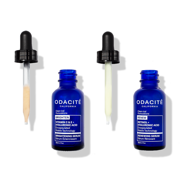 Two blue Odacité Bounce Back Power Duo bottles labeled Vitamin C + Retinol, both filled with liquid.