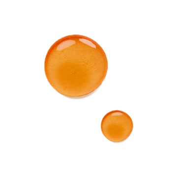 Two orange, glossy drops of Odacite Firming Buriti + Lime Bu+L Serum Concentrate on a plain white background.