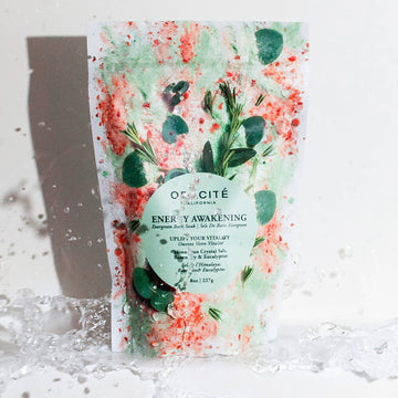Odacite Energy Awakening Himalayan bath soak with rosemary and eucalyptus in a clear jar with white label and black lid.