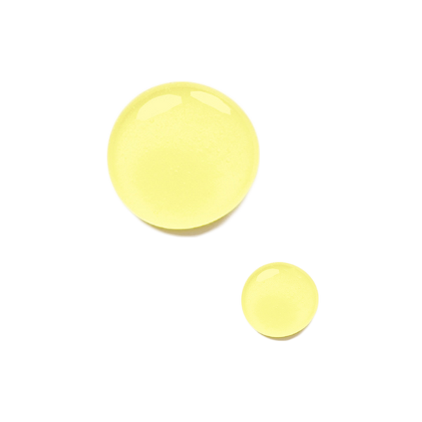 Two drops of Odacite Jo+L Jojoba + Lavender Serum Concentrate on a plain white background.