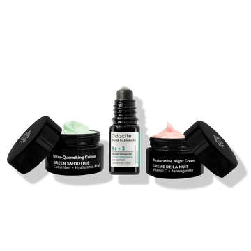 Odacité Like Night & Day Results Kit with green and pink face creams and a roll-on serum, all on a white background.