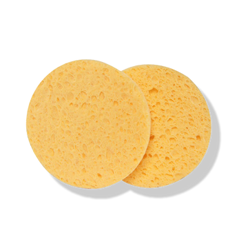 Odacite Facial Sponges, 2 sets of 2 round yellow biodegradable sponges with porous texture on a white background.