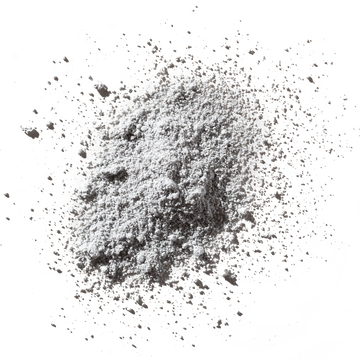 Odacite Synergie[4] Probiotics + Fruit Acids 4-IN-1 Powder Masque, loose powder scattered on a white surface.