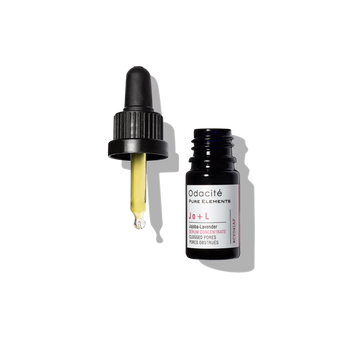 A dropper with yellow serum next to an open Odacite Clear + Decongest Pimple-Prone Duo bottle.